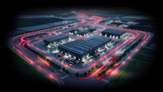 Soluțiile Linde contribuie la asigurarea fluxului de producție în industria auto. Vedere de sus a depozitului pe timp de noapte
